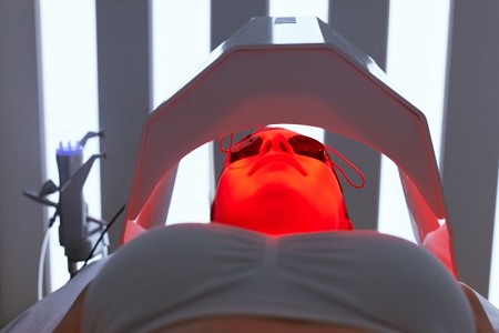 woman-with-goggles-using-red-light-therapy