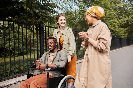 outside-wheelchair-with-friends