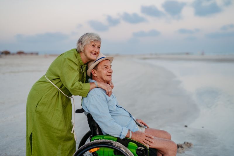elderly-couple-with-beach-wheelchair