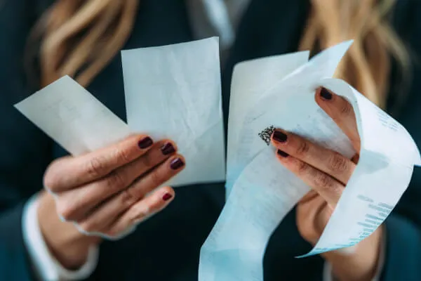 Woman reviewing her cryotherapy receipts