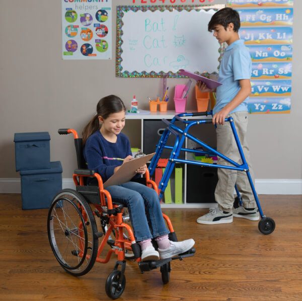 Boy using the Klip Gait Trainer Posterior Pediatric Walker with just one hand