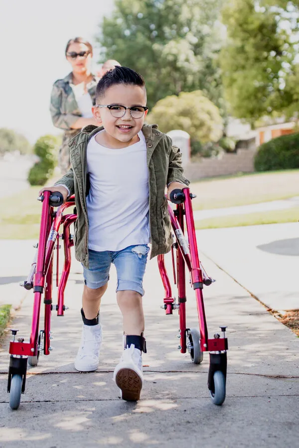 Child running using the Drive Nimbo Posterior Pediatric Walker and Gait Trainer