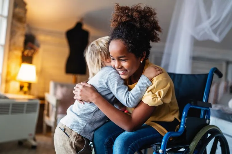 children-smiling-in-wheelchair
