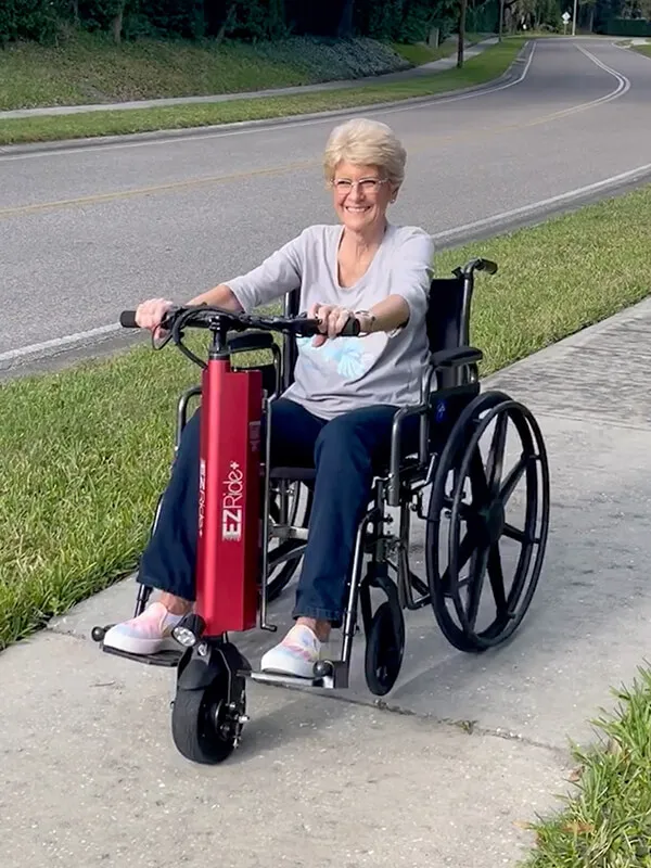 Elder woman cruising happy outdoors with the EZRIDE+