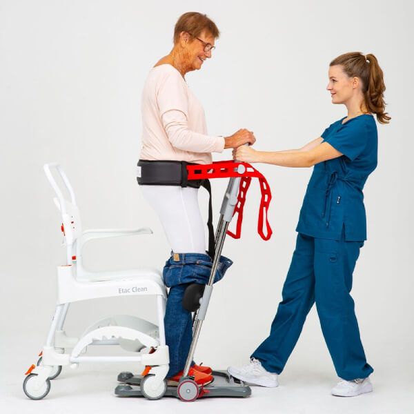 Elder woman using the Molift Raiser Pro Sit-to-Stand Patient Lift to get up from wheelchair