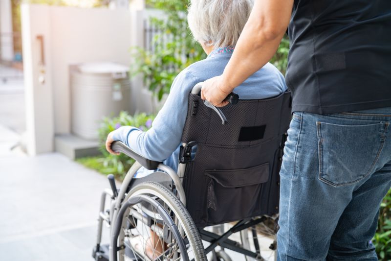 elderly-woman-being-pushed-in-wheelchair