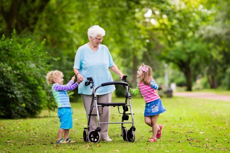 elderly-woman-with-walker-and-children