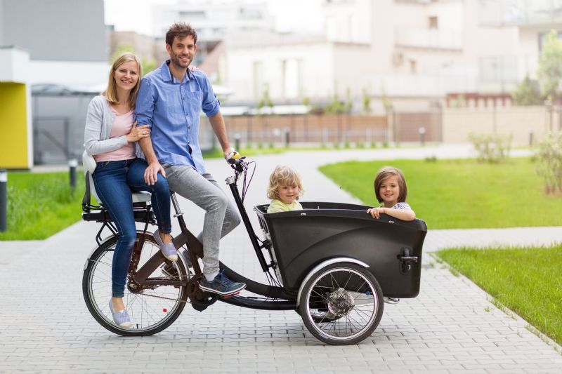 family-riding-cargo-tricycle