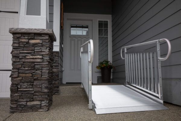 GATEWAY 3G Solid Surface Portable Ramp by EZ ACCESS attached to home threshold