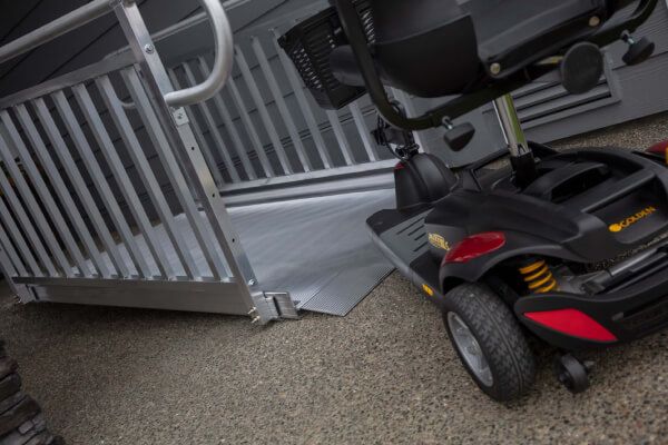Heavy Duty Scooter using the GATEWAY 3G Solid Surface Portable Ramp by EZACCESS