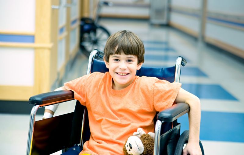 little-boy-in-too-big-wheelchair