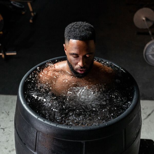 Man doing ice bath for muscle recovery
