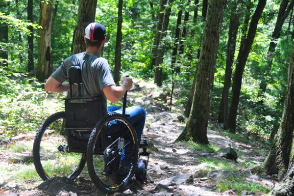 Man exercising outdoors with the GRIT Freedom Chair