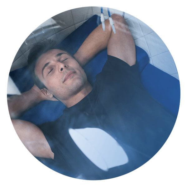 Man resting and operating an hyperbaric chamber by himself