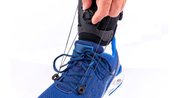 Person adjusting the SaeboStep AFO Brace for Drop Foot for a customize fit