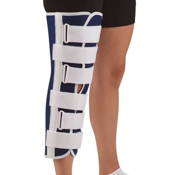 Person wearing the Sized Canvas Knee Immobilizer to take care of knee