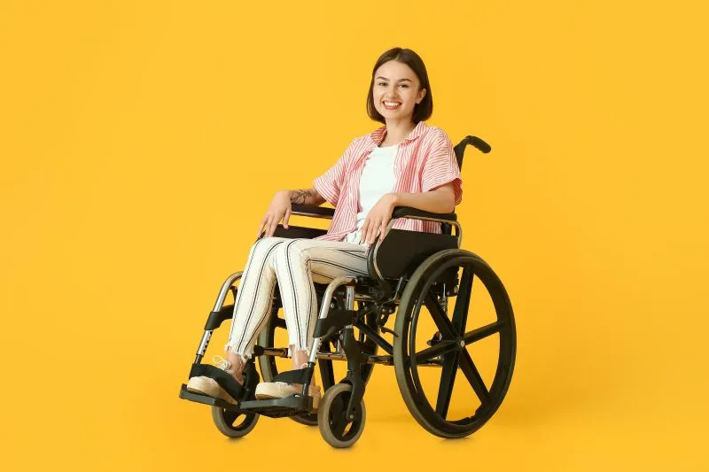 Woman in yellow wheelchair