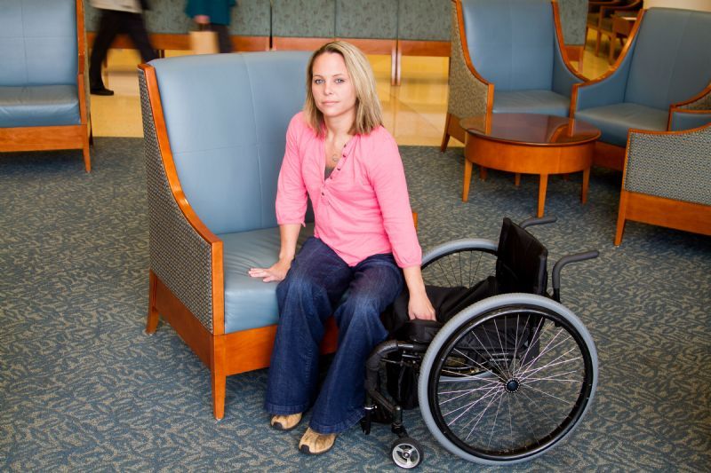 woman-transferring-from-wheelchair-to-chair