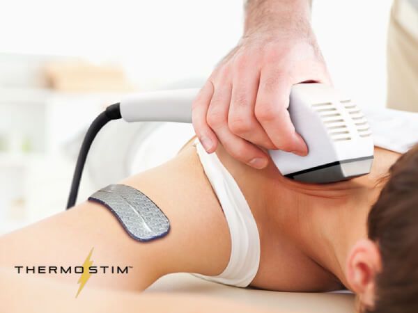 Woman receiving Heat Therapy on the neck with the Dynatron Solaris Plus