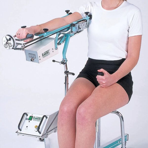 Woman using a Continuous Passive Motion Machine to strengthen her arm muscles