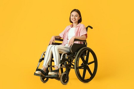 Woman-in-wheelchair-yellow-bg